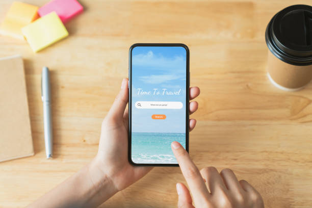 istock Hand using smartphone and search for vacation travel trips on mobile with booking hotel on website, Summer, holiday concept. 1764557874