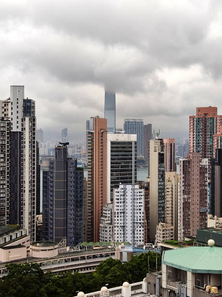 istock Hong Kong skyline under storm clouds 1764571113