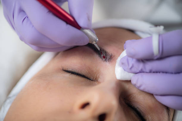 istock Microblading of eyebrows. Beauty with expert microblading services at beauty salon. 1764577362