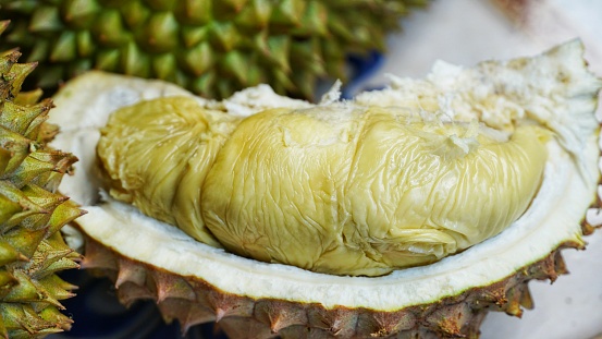 Durian fruit. Ripe durian. Tasty durian that has been peeled, A Southeast Asian durian fruit for sale at the market.