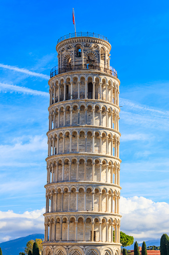 Section of the leaning tower of Pisa against the blue sky
