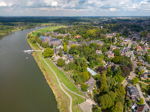 Steyl, Netherlands - 9 21 2022: Aerial picture of Steyl with the Maas and the ferry service from Steyl towards Baarlo