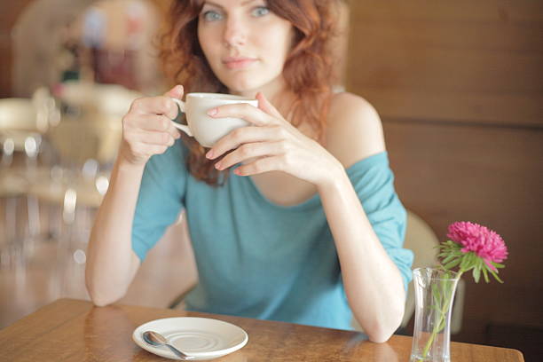 istock Redhead Woman Drinking Coffee 176460303