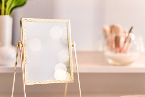 istock Reflection of christmas tree, light bulbs, in table mirror on woman dressing table with make up accessories 1764604151