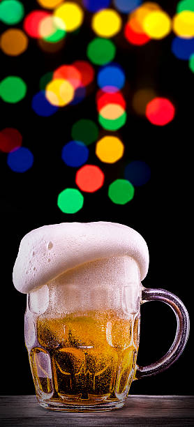 istock Frosty glass of light beer on party background 176461768