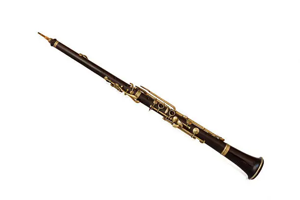 Old oboe on a white background