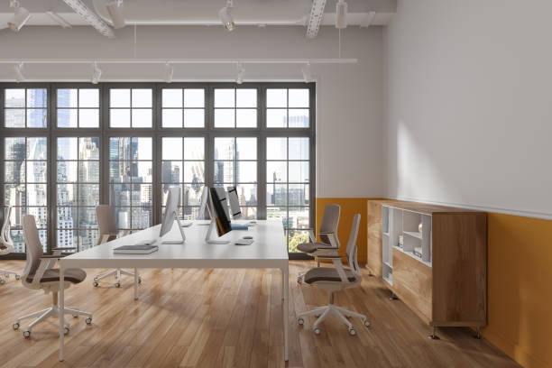 istock Stylish coworking interior with pc monitors and sideboard, panoramic window 1764640001