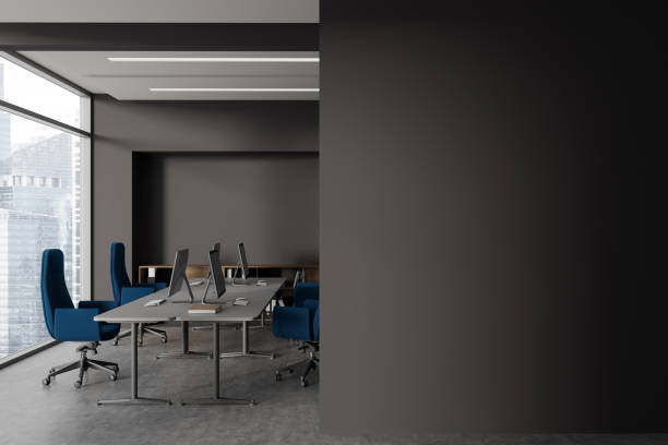 istock Brown office interior with pc monitors and shelf, window. Mock up wall 1764643152