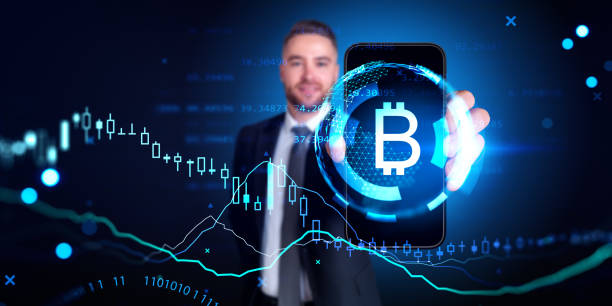 istock Man showing smartphone with bitcoin and graphs 1764646958