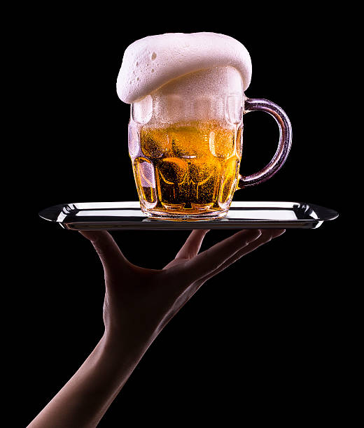 istock Frosty glass of light beer on black background 176464920