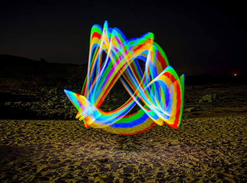 A light painted blur on the sand