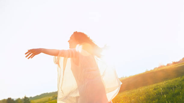 istock Smiling woman standing against sky 1764661533
