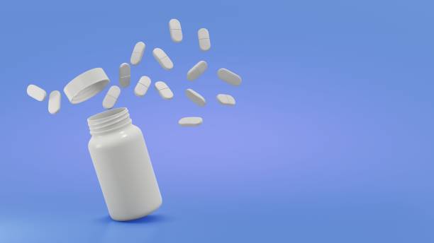 istock Explode the pills from the bottle of in air on the blue background 1764666492