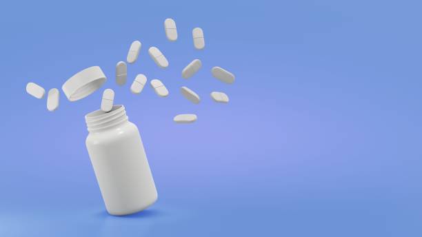 istock Explode the pills from the bottle of in air on the blue background 1764666493