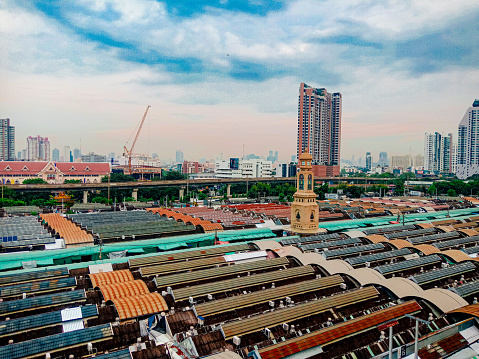 The high-angle photo captures a stunning expanse of a deep blue sky above Chatuchak, Thailand, revealing a scene of endless horizons and boundless possibilities.