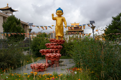 Little Buddha Shakyamuni statue in the gardens of the Gandantegchinlen, or locally known, Gandan monastery in Mongolia's capital city of Ulaanbaatar.