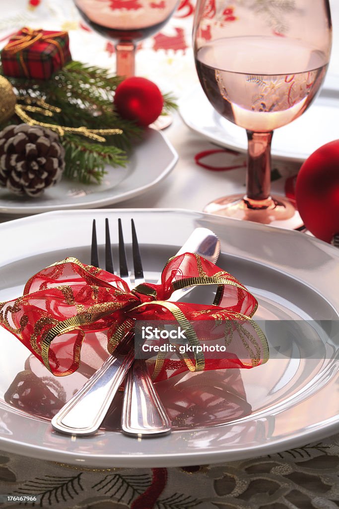 Christmas place setting with ribbon and decorations Christmas place setting with ribbon and christmas decorations Arrangement Stock Photo