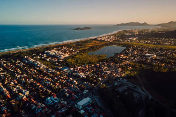 istock Coastline with ocean and town with sunset lights in Campeche, Florianopolis 1764681377