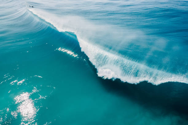 istock Blue barrel wave in Atlantic ocean. Crashing surfing wave. Aerial view 1764681383