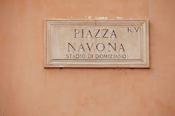 Historic street sign on building wall in Rome, capital of Italy