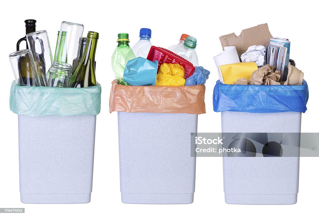 Recycling rubbish Recycling rubbish. Tree bins full of plastic, paper and glass Bottle Stock Photo