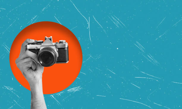 istock Digital collage showing a hand holding a vintage film camera. 1764718282