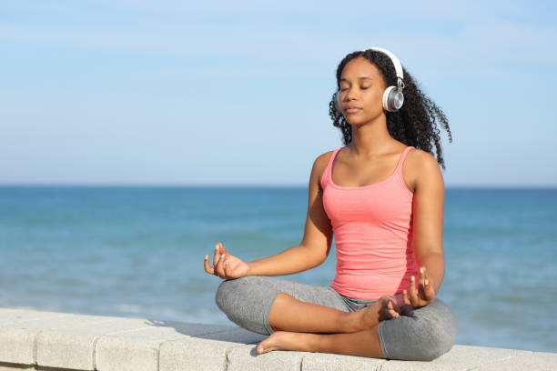 istock Black yogi doing yoga listening audio guide 1764722716