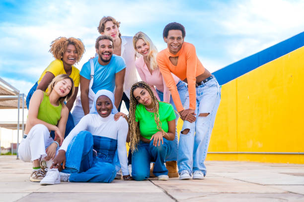 istock Multi-ethnic young people posing outdoors and smiling together 1764730903