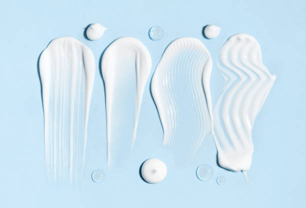 istock cosmetic smears cream texture on pastel blue background 1764731456