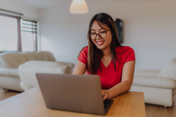 istock Asian women using digital devices at home 1764737946