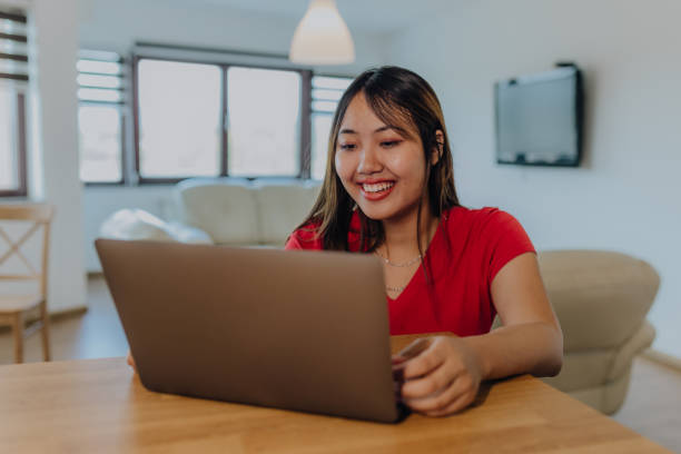 istock Asian women using digital devices at home 1764740601
