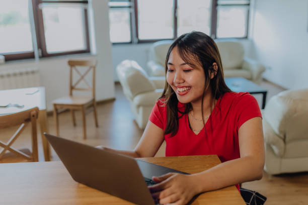 istock Asian women using digital devices at home 1764740604