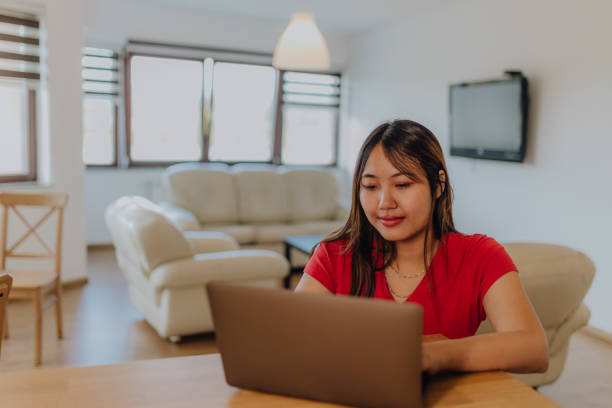 istock Asian women using digital devices at home 1764740628