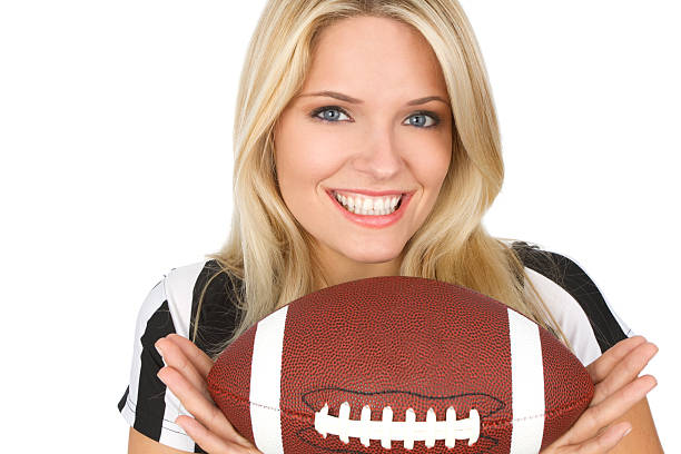 beautiful girl holding football on white background