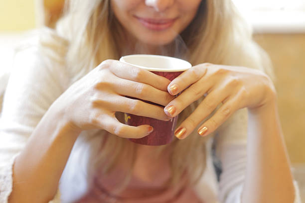 istock The young beautiful girl with a cup 176474902