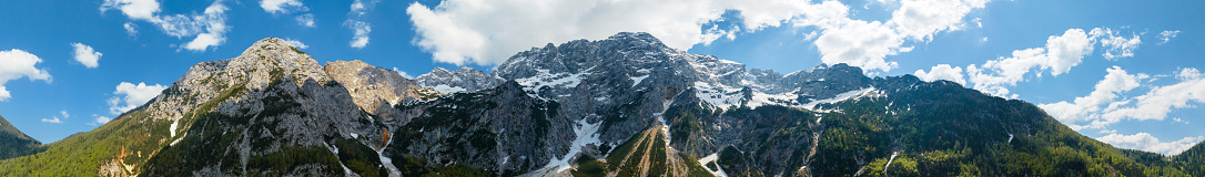 Zgornje Jezersko mountains in Slovenia aerial view during a beautiful springtime day with the mountain range around the Grintovec mountain peak in the Kamnik–Savinja Alps.