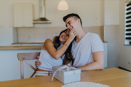 Young man givinggift to his girlfriend