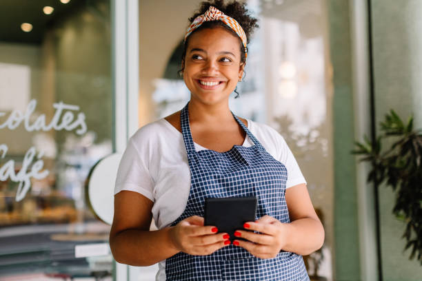 istock Female entrepreneur in cafe embracing digital technology 1764773199