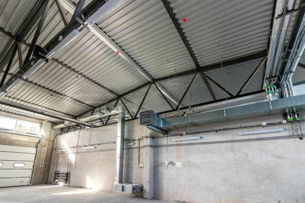 istock Ventilation pipes in silver insulation material hanging from the ceiling inside new building 1764779275