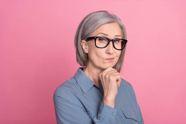 istock Photo of gorgeous minded lady office manager arm touch face solving problem dilemma isolated on pink color background 1764787639