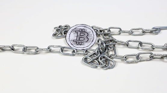 Popular cryptocurrency most famous coin in the world bitcoin chained on white background.
