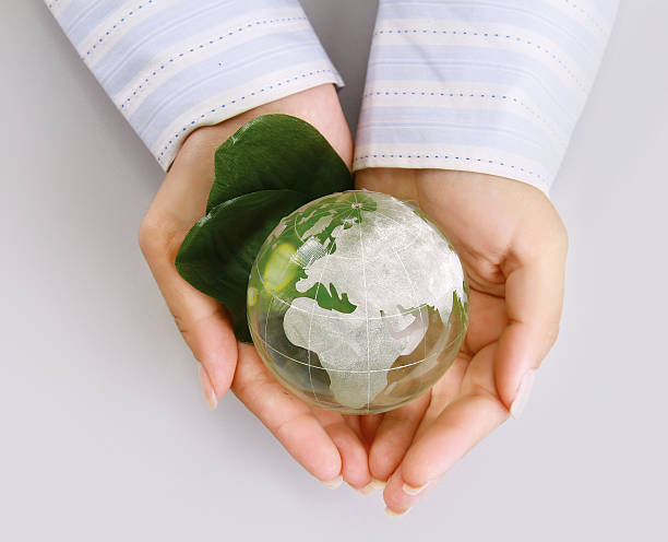 istock attractive woman holding a glass globe 176480211