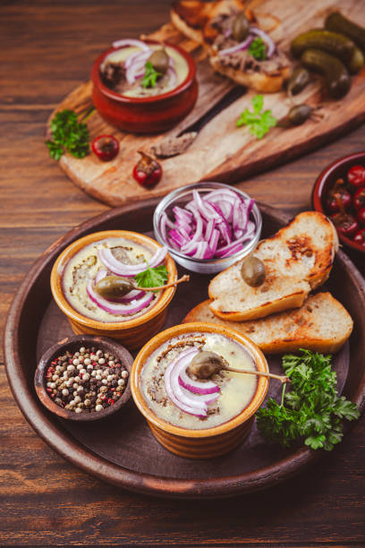 istock Fresh homemade chicken liver pate in ceramic bowls and appetizers on rustic background 1764802876