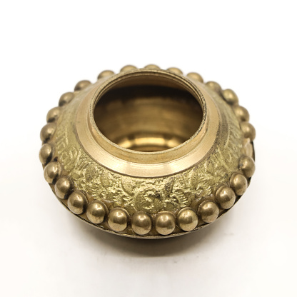 women's traditional sindoor jewellery box in gold with crafted antique details of luxury isolated in a white background