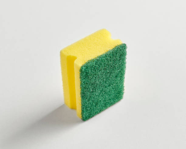 istock Kitchen dish sponge yellow and green isolated white background. 1764837815