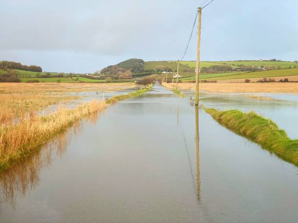 Excessive road flooding due to spring tides and heavy rain stock photo