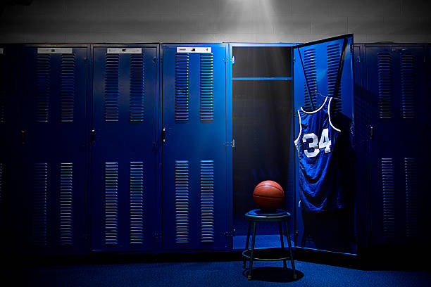Basketball Locker Room An open locker with a jersey and ball in a authentic basketball locker room. Lots of Copy Space locker room stock pictures, royalty-free photos & images