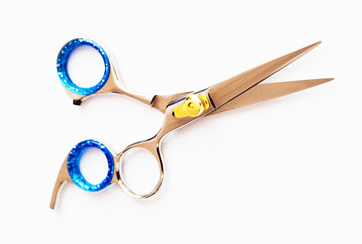 Brightly colored scissors used by trendy hairdressers.