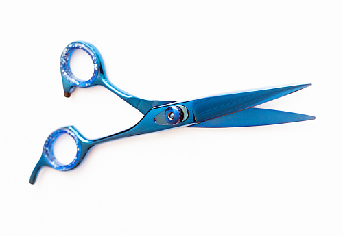 Brightly colored scissors used by trendy hairdressers.