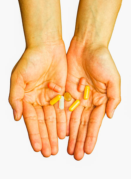 Hands Holding Medicines stock photo